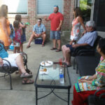 Conversation by the house